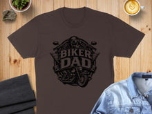 Load image into Gallery viewer, Brown t-shirt featuring a "Biker Dad" graphic with a motorcycle and skull.
