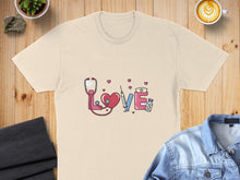 Load image into Gallery viewer, Cream t-shirt with medical icons: stethoscope, heart, syringe, and pills.
