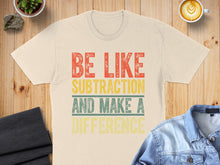Load image into Gallery viewer, Cream t-shirt with "Be Like Subtraction And Make A Difference" text.
