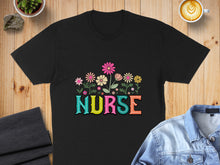 Load image into Gallery viewer, Black t-shirt with colorful floral "NURSE" text design.
