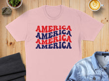 Load image into Gallery viewer, Pink t-shirt with "AMERICA AMERICA AMERICA" in red, white, and blue.
