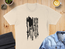 Load image into Gallery viewer, Cream t-shirt with distressed black American flag featuring fighter jets.
