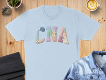 Load image into Gallery viewer, Light blue t-shirt with "CNA" in patchwork quilt letters.
