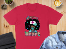 Load image into Gallery viewer, Red t-shirt with black woman wearing mask and "Nursing is a work of Heart" text.
