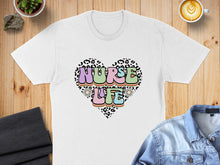 Load image into Gallery viewer, White t-shirt with colorful "NURSE LIFE" text inside a leopard print heart.
