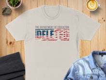 Load image into Gallery viewer, Light gray t-shirt with "THE DEPARTMENT OF EDUCATION DELETED" text and American flag graphic.
