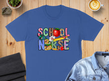 Load image into Gallery viewer, Blue t-shirt with "SCHOOL NURSE" text in colorful, patterned letters and school supplies.
