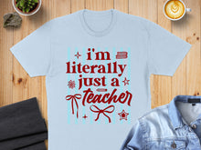 Load image into Gallery viewer, Light blue t-shirt with red text "I'm literally just a teacher" and festive accents.
