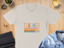 Load image into Gallery viewer, Cream t-shirt with "TEACHER" text and colorful stripes.
