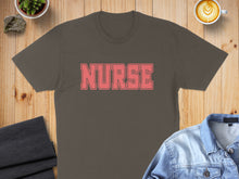 Load image into Gallery viewer, Brown t-shirt with "NURSE" in pink block letters.
