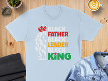 Load image into Gallery viewer, Light blue t-shirt with "Black Father Black Leader Black King" text and lion graphic.
