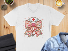Load image into Gallery viewer, White t-shirt featuring a pink nurse's cap and bow with XOXO and hearts.
