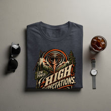 Load image into Gallery viewer, Dark gray t-shirt with "LOW POWER. HIGH EXPECTATIONS." graphic.
