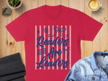 Load image into Gallery viewer, Red t-shirt with blue text "Readers Are Leaders" and decorative bows.
