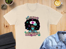 Load image into Gallery viewer, Cream t-shirt with "Nursing is a work of heart" graphic featuring a nurse with curly hair.
