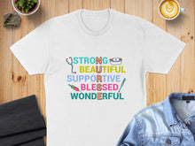 Load image into Gallery viewer, White t-shirt with "STRONG BEAUTIFUL SUPPORTIVE BLESSED WONDERFUL" text and medical icons.
