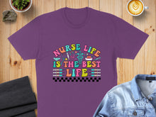 Load image into Gallery viewer, Purple t-shirt with colorful "Nurse Life is the Best Life" text and medical icons.

