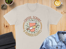 Load image into Gallery viewer, T-shirt graphic with coffee cup, syringe, and text "Coffee, Scrubs &amp; Rubber Gloves".
