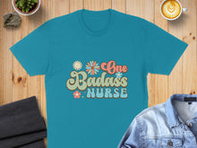 Load image into Gallery viewer, Teal t-shirt with "One Badass Nurse" floral graphic in retro font.
