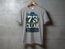 Load image into Gallery viewer, Grey t-shirt with colorful "73 AND CLEAR" graphic featuring radio equipment and world map.
