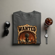 Load image into Gallery viewer, Grey t-shirt with "WANTED:" text and a microphone in a desert scene.
