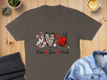 Load image into Gallery viewer, Brown t-shirt with peace sign, leopard print heart, and stethoscope graphic.
