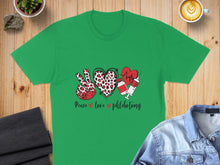 Load image into Gallery viewer, Green t-shirt with peace sign, heart, and stethoscope with text "Peace love phlebotomy".
