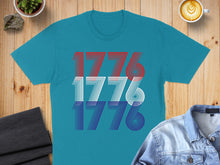 Load image into Gallery viewer, Teal t-shirt with "1776" in red, white, and blue stripes.
