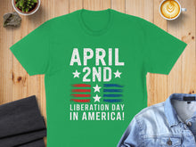 Load image into Gallery viewer, Green t-shirt with "April 2nd Liberation Day in America!" text and flag design.
