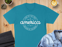 Load image into Gallery viewer, Teal t-shirt with "America Land of the Free Since 1776 Because of the Brave" text.

