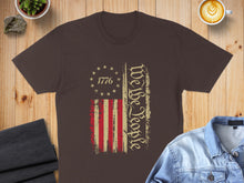 Load image into Gallery viewer, Brown t-shirt with distressed American flag and "We the People" text.
