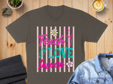 Load image into Gallery viewer, Dark grey t-shirt with pink and turquoise "Teach Love Inspire" text, flowers, and pencil graphic.
