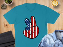 Load image into Gallery viewer, Turquoise t-shirt with a peace sign made of the American flag.
