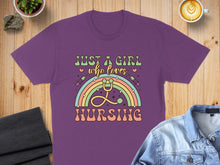 Load image into Gallery viewer, Purple t-shirt with "Just a girl who loves nursing" text and rainbow stethoscope design.
