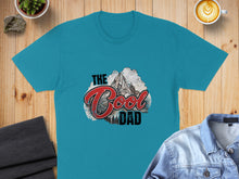 Load image into Gallery viewer, Teal t-shirt with "The Cool Dad" text and mountain graphic.
