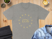 Load image into Gallery viewer, Grey t-shirt with a circle of stars and "1776" text.
