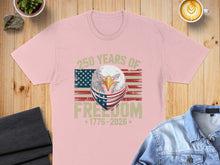 Load image into Gallery viewer, Pink t-shirt with eagle wearing bandana, US flag, "250 Years of Freedom 1776-2026".
