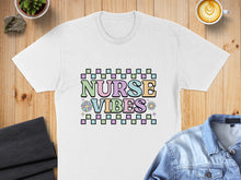 Load image into Gallery viewer, White t-shirt with "Nurse Vibes" text and pastel geometric blocks.
