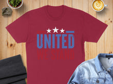 Load image into Gallery viewer, Burgundy t-shirt with "UNITED WE STAND" text and three white stars.
