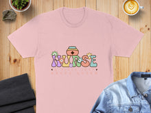 Load image into Gallery viewer, Pink t-shirt with colorful "Nurse" text and flowers, above "A Title Just Above Queen".
