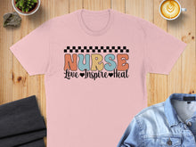 Load image into Gallery viewer, Pink t-shirt with "NURSE Love Inspire Heal" text in retro lettering.

