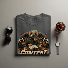 Load image into Gallery viewer, T-shirt graphic shows a ham radio operator with radios, clocks, and the word "CONTEST".
