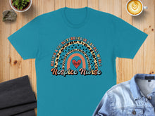 Load image into Gallery viewer, Turquoise t-shirt with "Hospice Nurse Making a Big Difference in a Small World" rainbow graphic.

