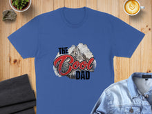 Load image into Gallery viewer, Blue t-shirt with "The Cool Dad" text and mountain graphic.
