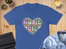 Load image into Gallery viewer, Blue t-shirt with heart graphic featuring "Nurse Life" text.
