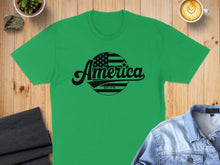 Load image into Gallery viewer, Green t-shirt with "America EST. 1776" text and American flag circle graphic.
