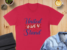 Load image into Gallery viewer, Red t-shirt with "United We Stand" text and patriotic graphic.

