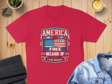 Load image into Gallery viewer, Red t-shirt with "America Land of 1776 Free Because of the Brave" graphic.
