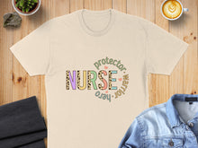 Load image into Gallery viewer, T-shirt with "Nurse protector warrior hero" text in colorful letters.
