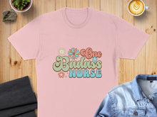 Load image into Gallery viewer, Pink t-shirt with "One Badass Nurse" text and floral graphics.
